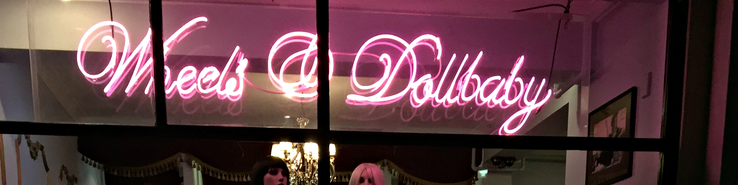 wheels and dollbaby sign